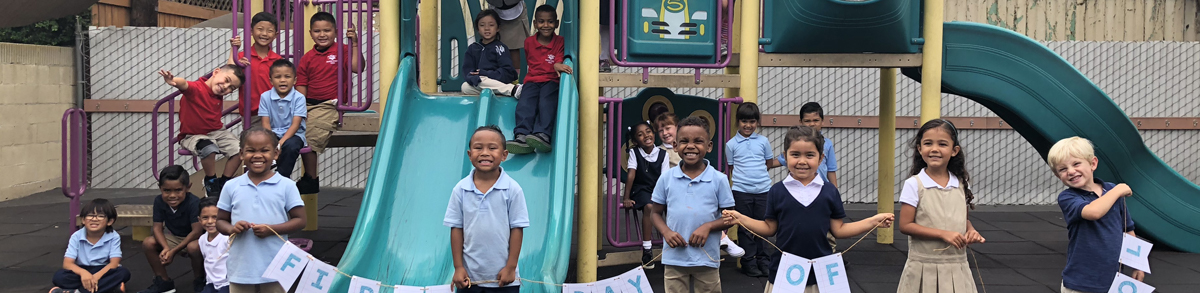 Students posing on a playground